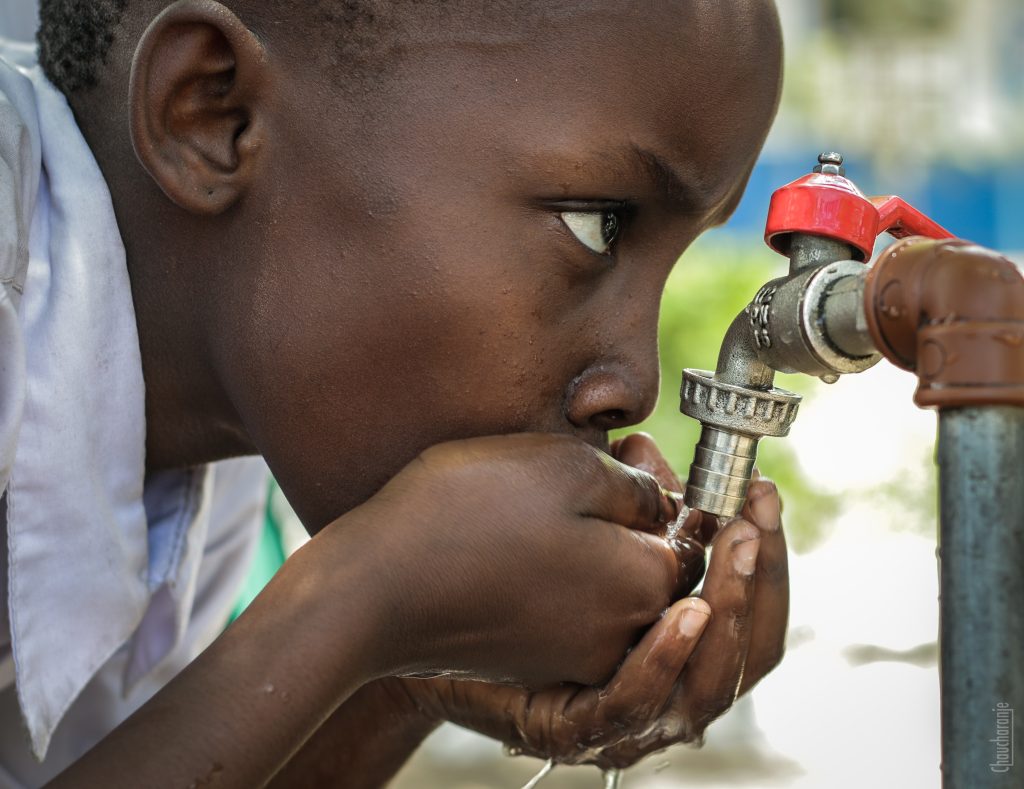 Boy drinking water on faucet 1446504